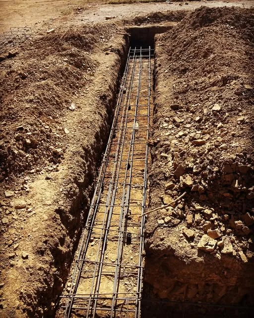 Reinforcing steel cage in an excavated foundation trench
